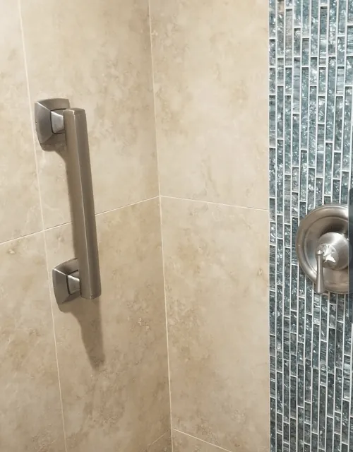 Moen designer vertical grab bar in a tiled shower