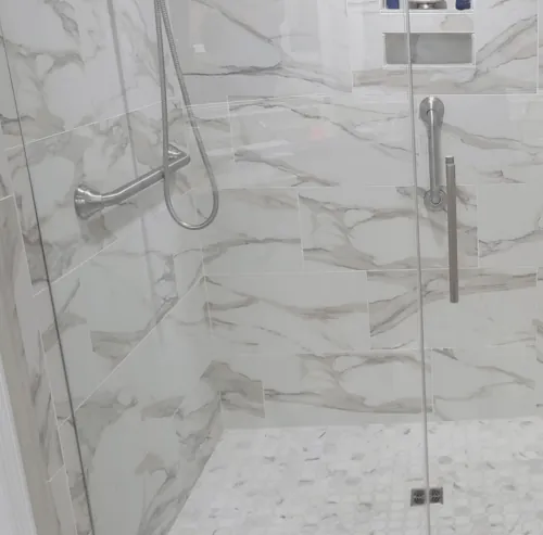 Grab bar installed on a marble shower wall in Stuart, Florida